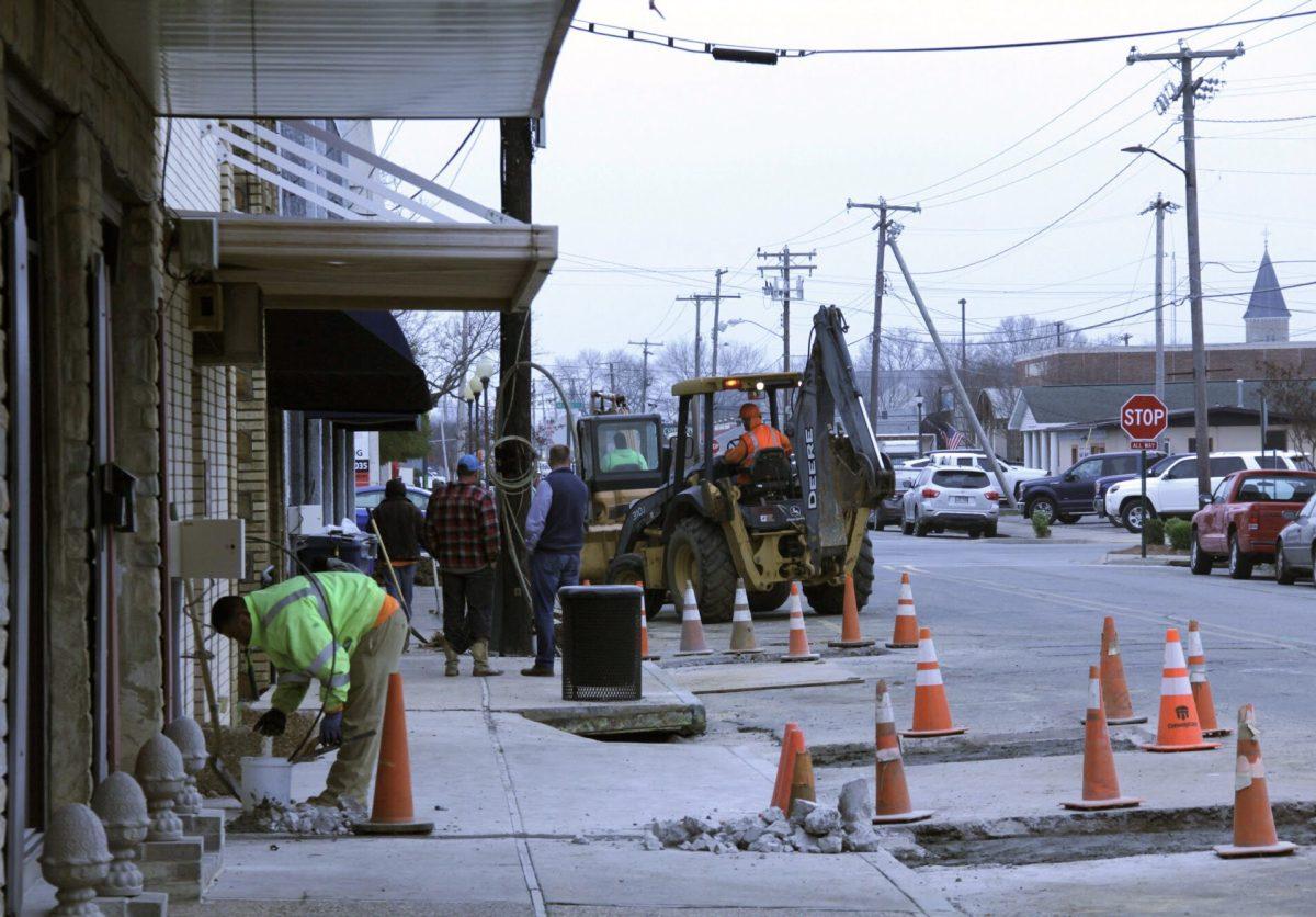 Construction workers drive equipment down Chestnut street toward Main street at Feb. 28 in downtown Conway. Parts of Van Ronkle and Chestnut streets are closed for an indefinite amount of time, according to the City of Conway Transportation Department.photo by Chirstine Nichols
