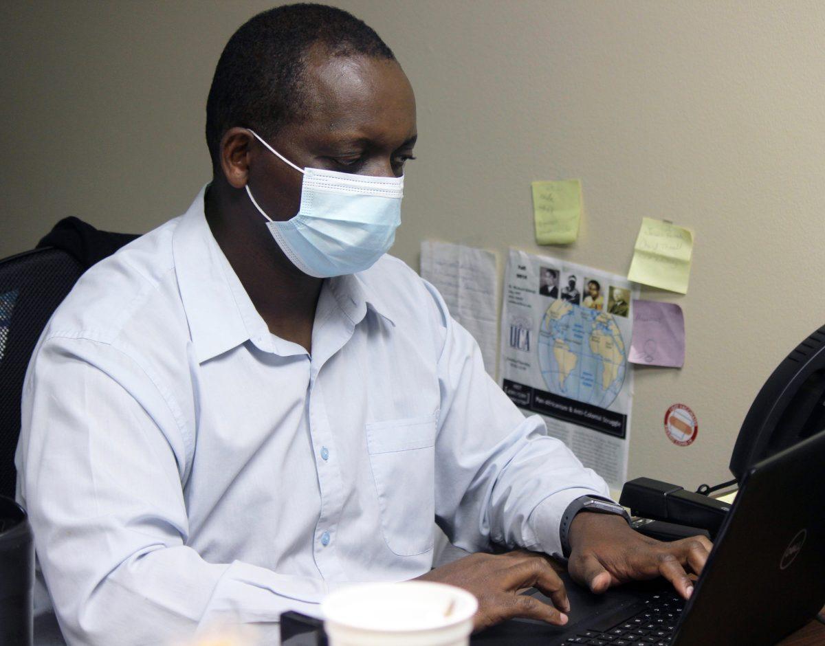 Michael Kithinji, director of the African/African American studies program, responds to press requests in his office in Irby Hall. Kithinji has been vocal about his distaste of the handling of the AAAS major. 