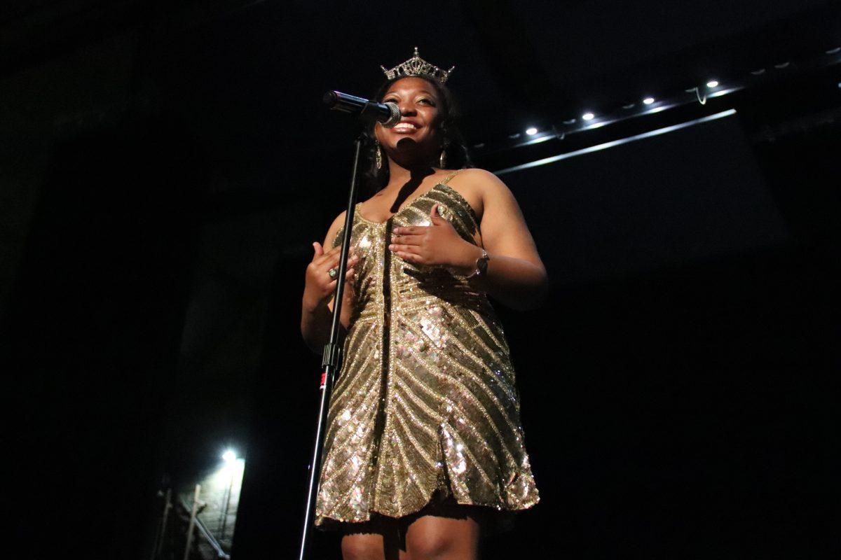 Miss UCA, Nia Kelley, addresses the crowd before performing at the New Member King pageant. Alpha Sigma Alpha raised $3,800 at the event. 