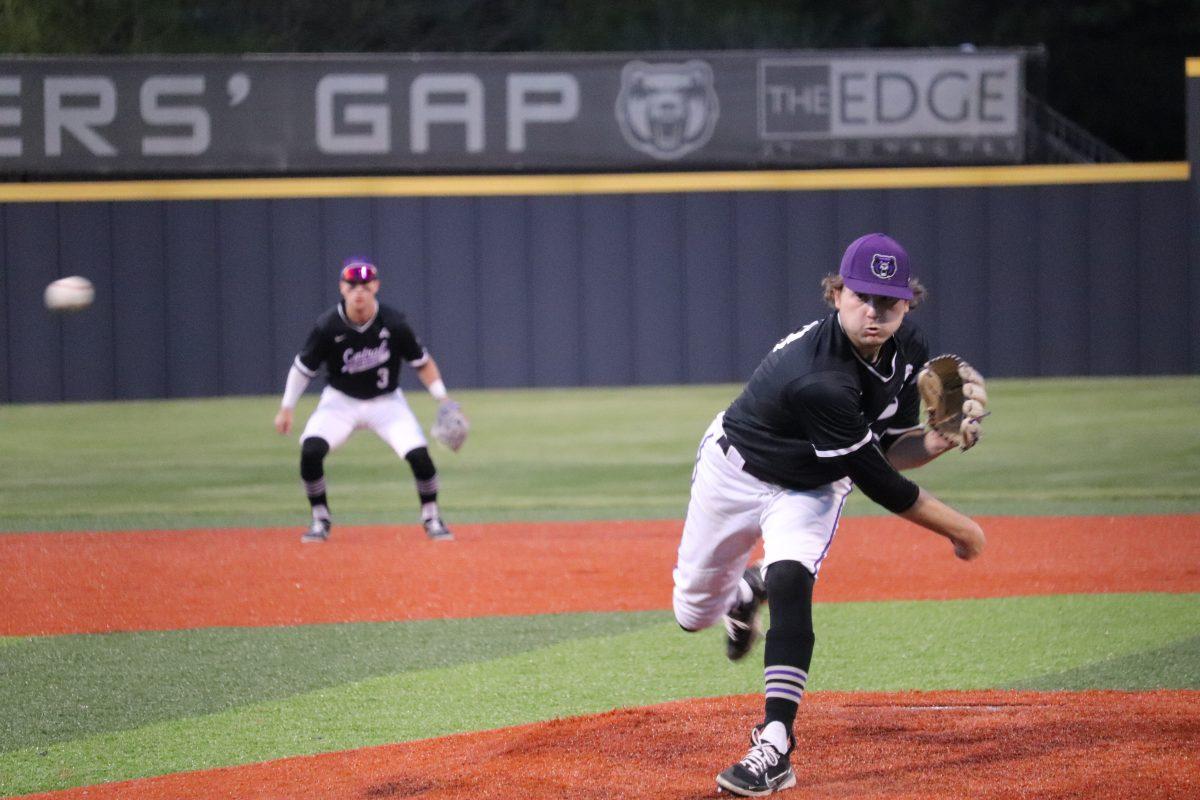 Sophomore Oliver Laufman throws a pitch with shortstop R.J. Pearson behind him. Laufman, who only allowed one earned run and two hits, pitched for the last four innings and struck out five Tigers. 
