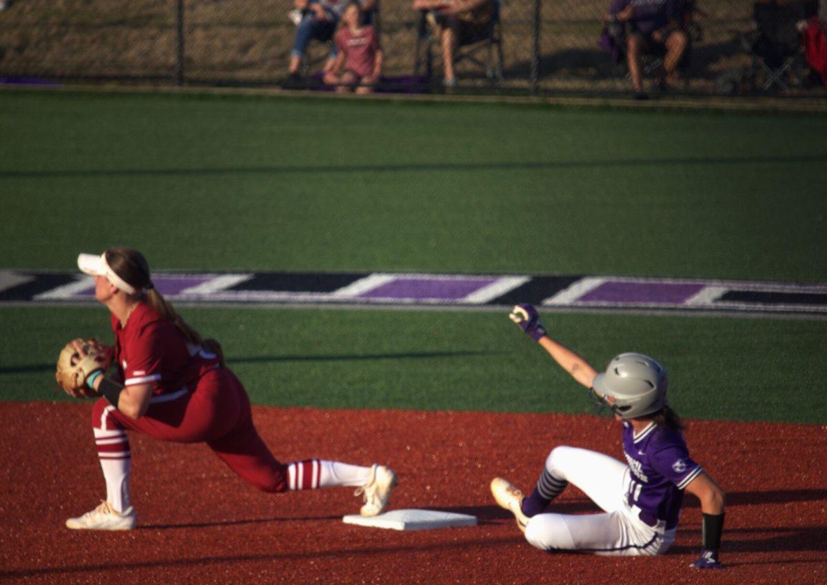 With a score of 5-0, redshirt junior Audrie La Valley catches the ball as freshman Kylie Griffin slides to second base in the bottom of the second inning. The Bears will hit the road this weekend, April 15-16, for a three-game series against Eastern Kentucky University. 