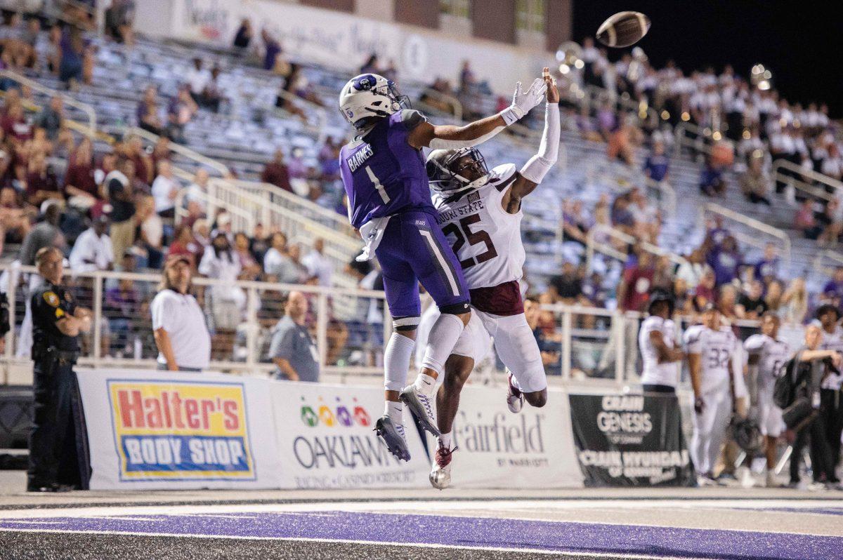 Junior wide receiver Jarrod Barnes catches air reaching for the ball during the Bears first game of the season. Despite a positive outlook from coach Nathan Brown, the team dropped the game with a score of 27-14 against Missouri State.