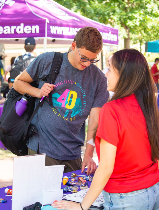 Karla Mezquita, secretary of the Latino Student Association, talks to students attending the RSO Fair. Students of different Latin backgrounds find community in LSA.