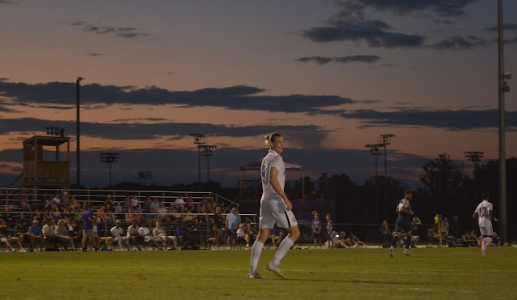 Senior Sebastian Andreassen looks to an out-of-frame teammate during a match against the University of North Florida, held Sept. 10. The men’s soccer team ended up taking their second win of the season.
