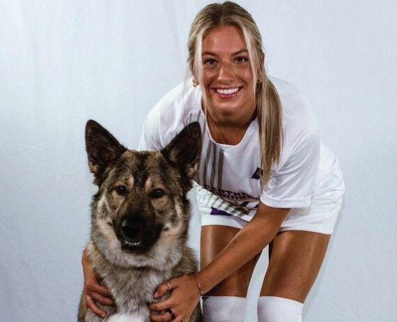Sydney Brough cuddles her dog Zeus. Brough is from Toronto, Canada, and has been playing soccer since eighth grade.