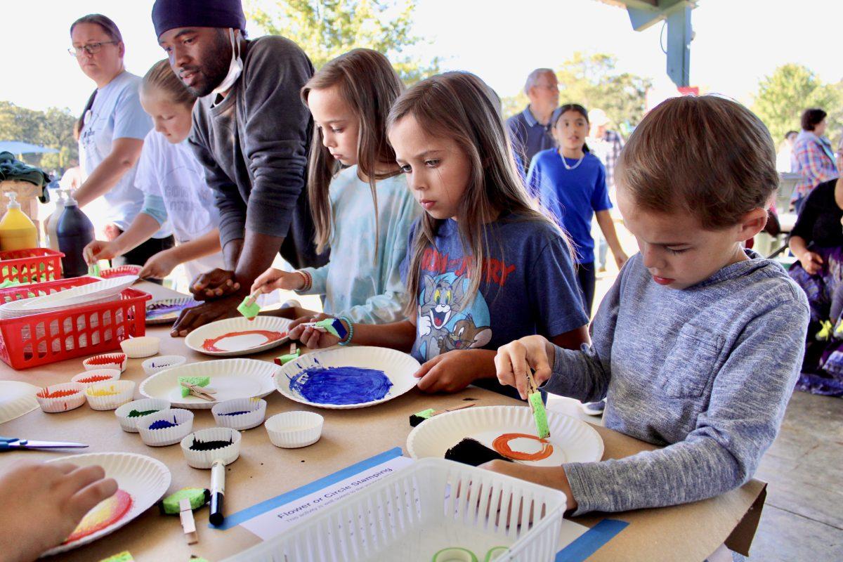Attendees paint together at ArtsFest in Conway on Oct. 1. The event featured several hands-on art activities for attendees to interact with various art forms.