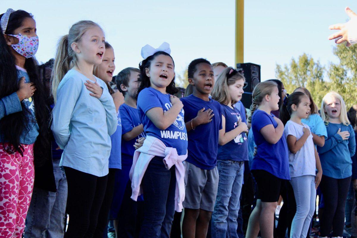 A choir of third- and fourth-grade students from Ida Burns, Woodrow Cummins and others sing to start of the Conway ArtsFest. The choir sang the National Anthem.