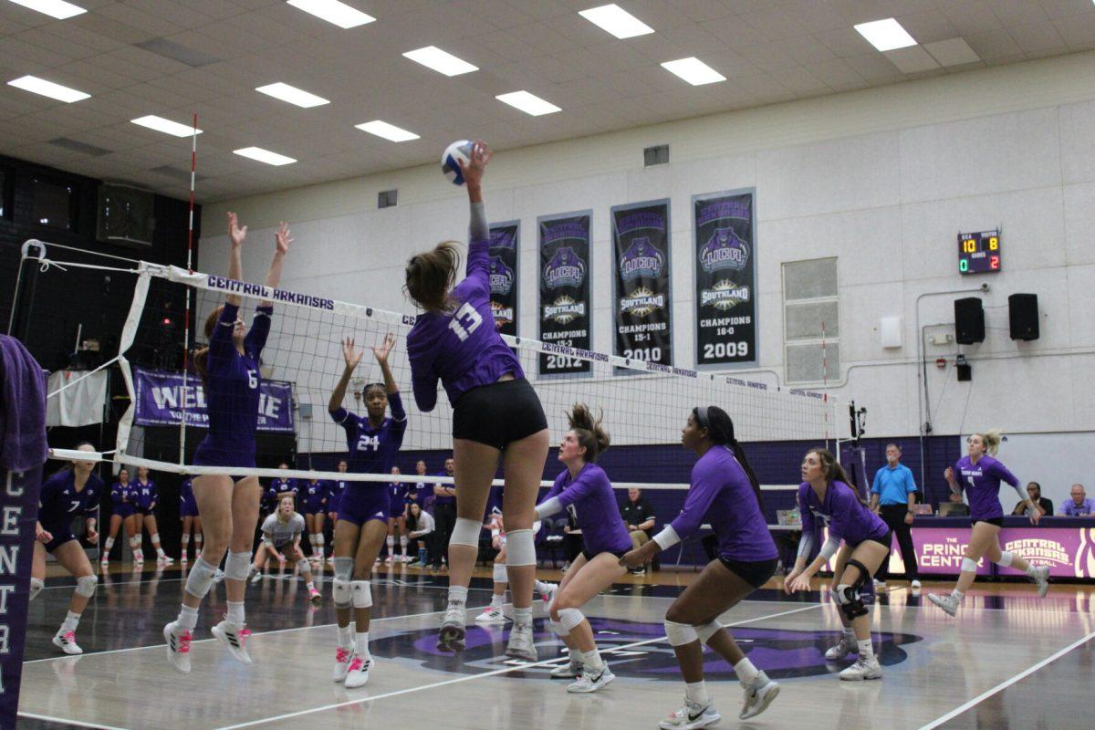 Sophomore outside hitter Lilly Taylor jumps for a spike against the North Alabama Lions. Taylor had eight kills throughout the game and was a leading player in regards to kills.