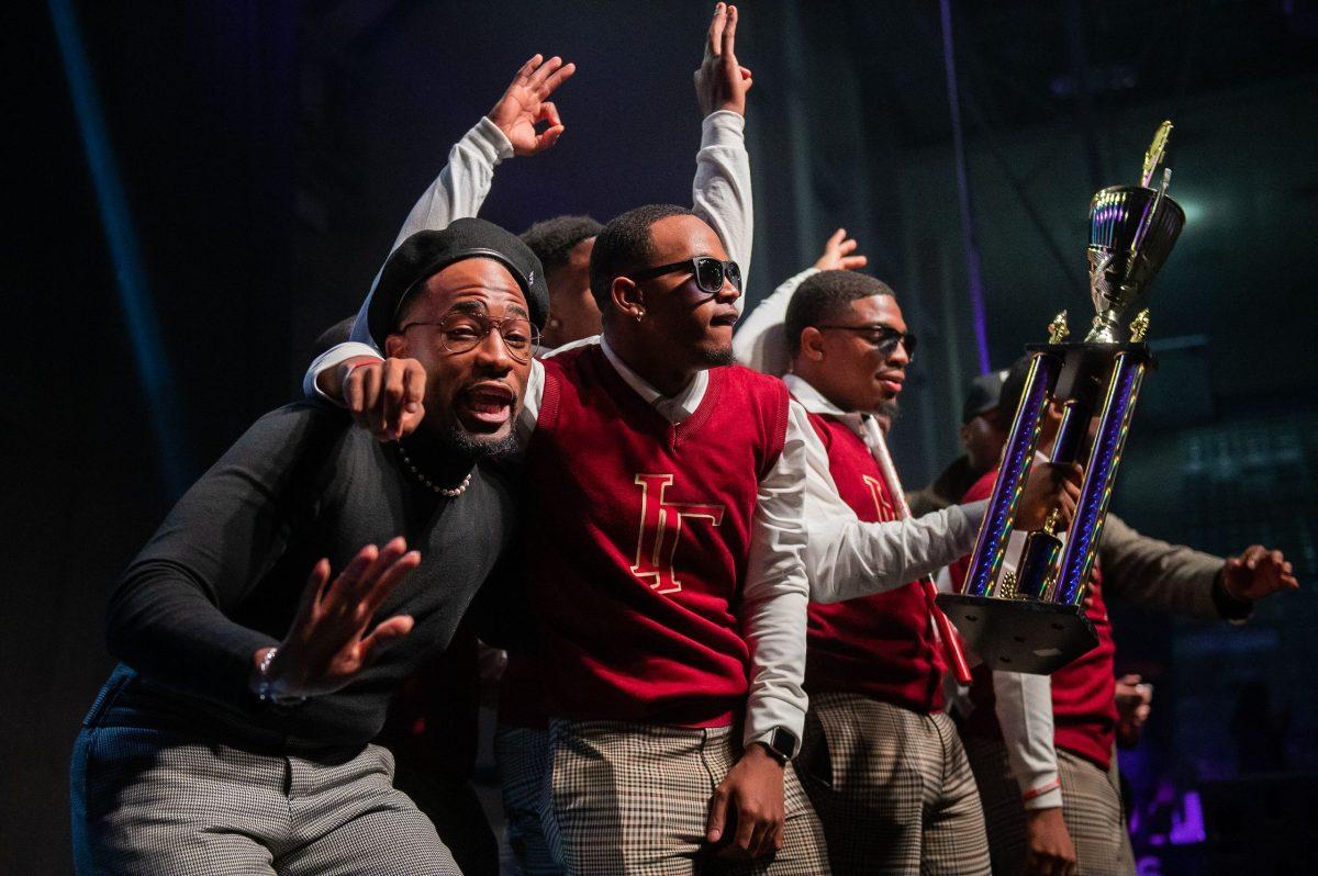 Kappa Alpha Psi celebrates winning the first place trophy and $1,500 prize for the brothers' 1977-themed stepping performance.