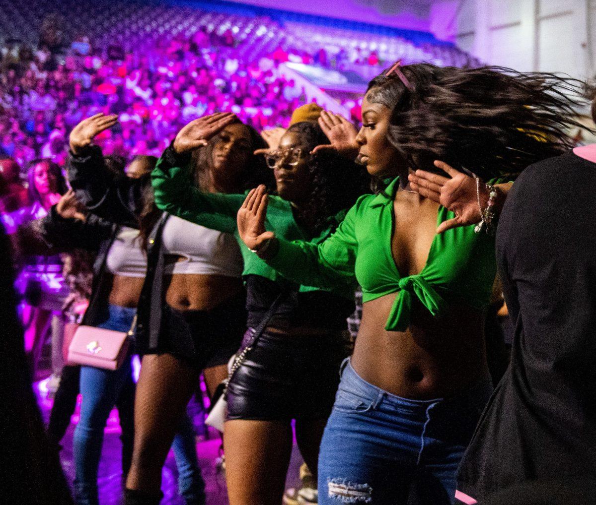 Attendees don the Alpha Kappa Alpha colors: green and pink. The Greek Step Show happens every Homecoming Week and serves as a chance for alums and current students to connect over the organization’s traditions.