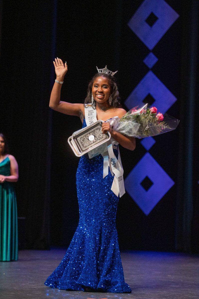 Simpson holds a bouquet of flowers after being crowned. Simpson won various other scholarships for her dance performance, GPA, cooperation during rehearsal and her pre-competition interview.