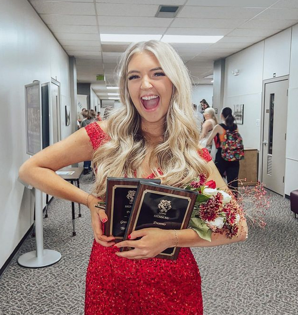 Gabi Pervis smiles with her awards after earning the title of Greek Goddess 2022. Pervis won the talent round and overall.