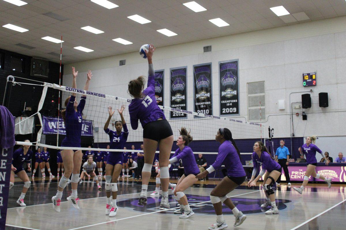 Sophomore outside hitter Lilly Taylor jumps for a spike against the North Alabama Lions. Taylor had eight kills throughout the game and was a leading player in regards to kills.
