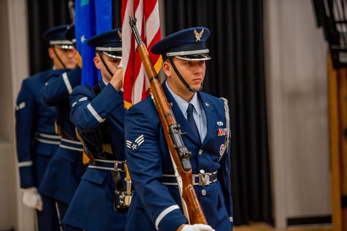 Servicemen present the colors during the men’s basketball “Salute to Service” game.