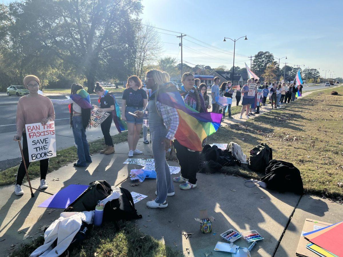 Conway High School students and community members line up during a walkout on the afternoon of Nov. 8 to protest recent decisions made by the Conway School Board. The students were warned of punishment if they participated in the walkout.