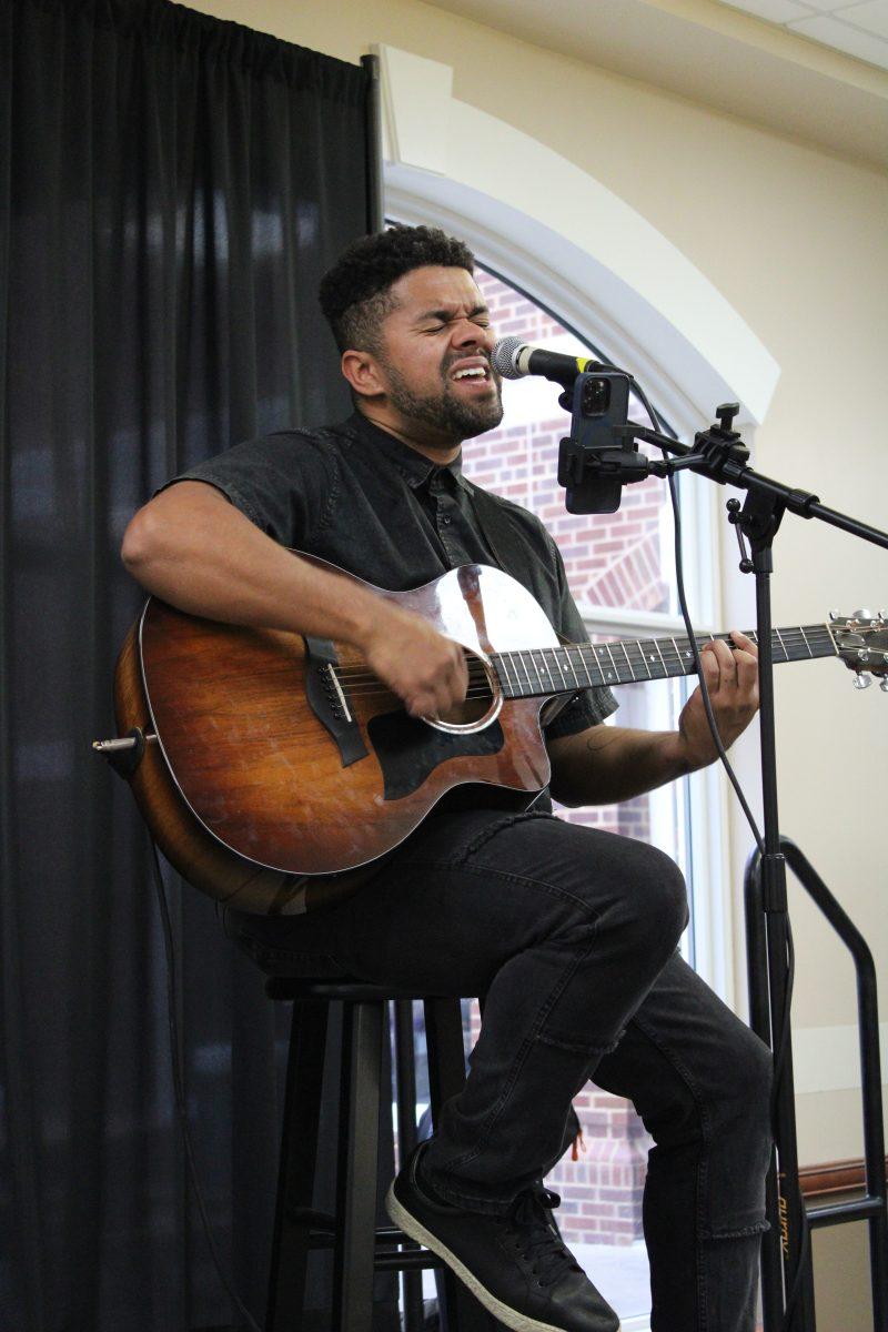 Cameron Bedell, a singer and songwriter from Nashville, Tennessee sings a song while playing the guitar for students dining in the Ronnie Williams Student Center food court. Bedell rose to fame after his cover songs went viral on the internet. Bedell encourages aspiring artists to not be shy and to step out of their comfort zones by using social media to promote their music.