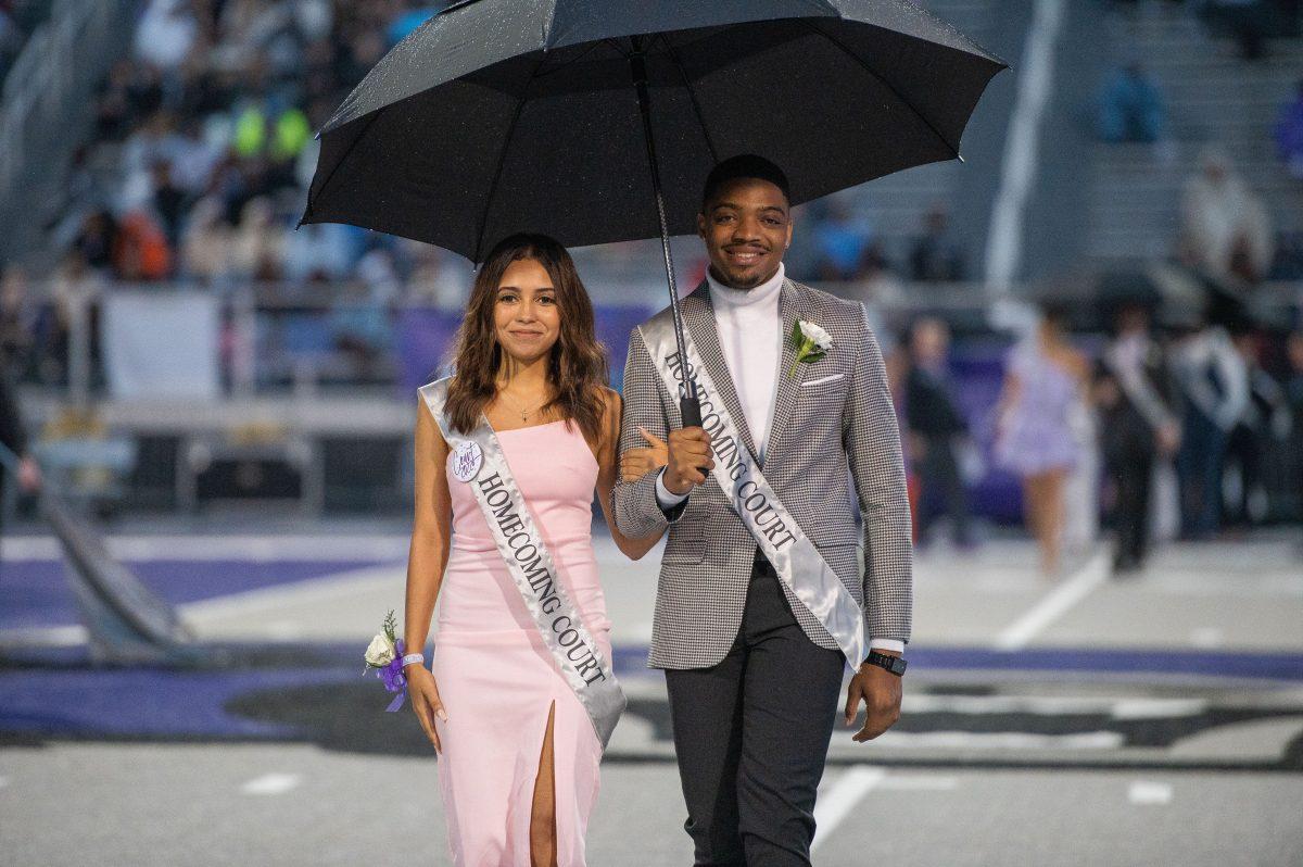 Homecoming Princess senior Anastasia Coleman (left) and senior Ryan Jones walk at the UCA Homecoming coronation.