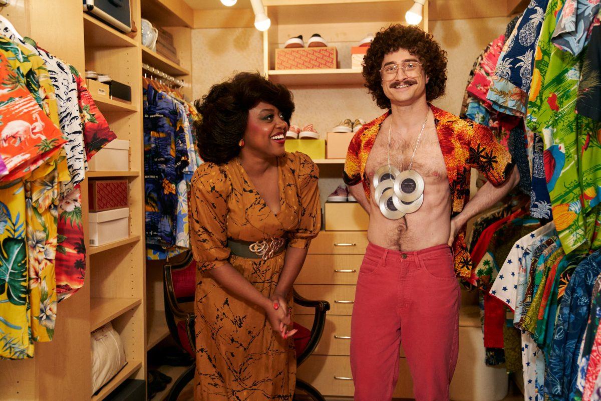 Quinta Brunson (left) plays Oprah and Daniel Radcliffe plays Al Yankovic in “Weird: The Al Yankovic Story.” The overexaggerated biopic was released to the Roku Channel Nov. 4.