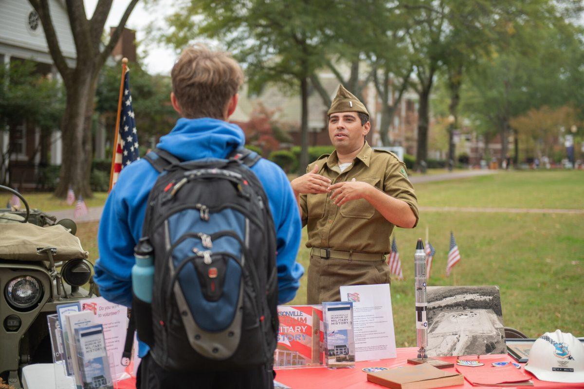 A student talks to a representative at the Veteran’s Day celebration at McCastlain Hall Nov. 3. The celebration honored people who are serving or have served in the U.S. military.