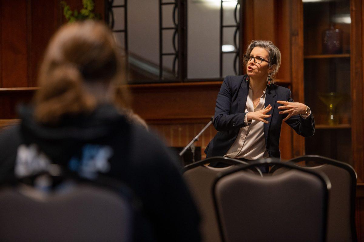 Associate professor Sonia Toudji talks to an audience in a public lecture held in honor of National Native American Heritage Month. Toudji said bringing awareness to Native American history begins with a gradual revision of pre-existing information, such as improving upon textbooks, which have historically been written in an eastern perspective.
