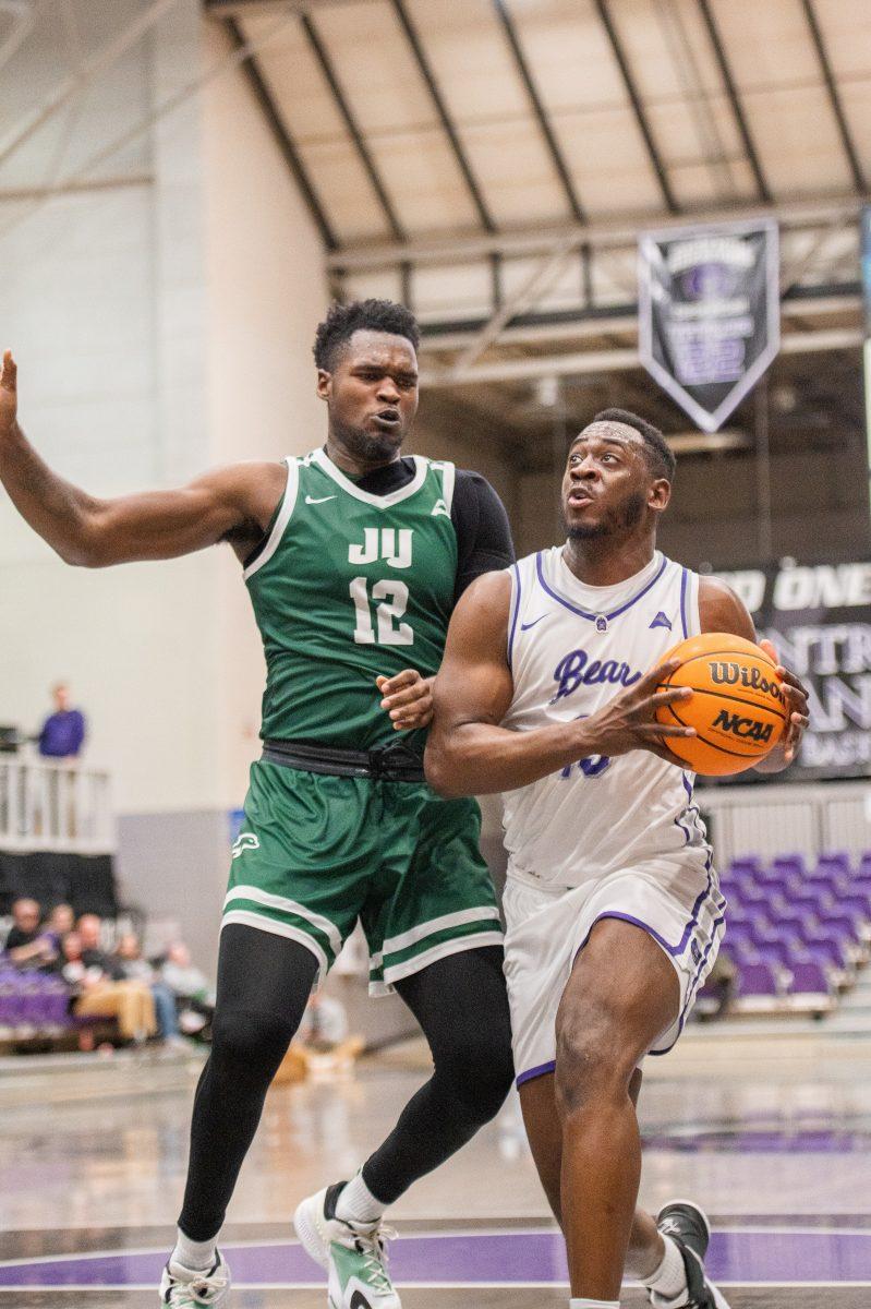 Senior guard/forward Eddy Kayouloud rushes to the net for a layup. Kayouloud earned the most rebounds for the Bears, clocking in at 7 rebounds.