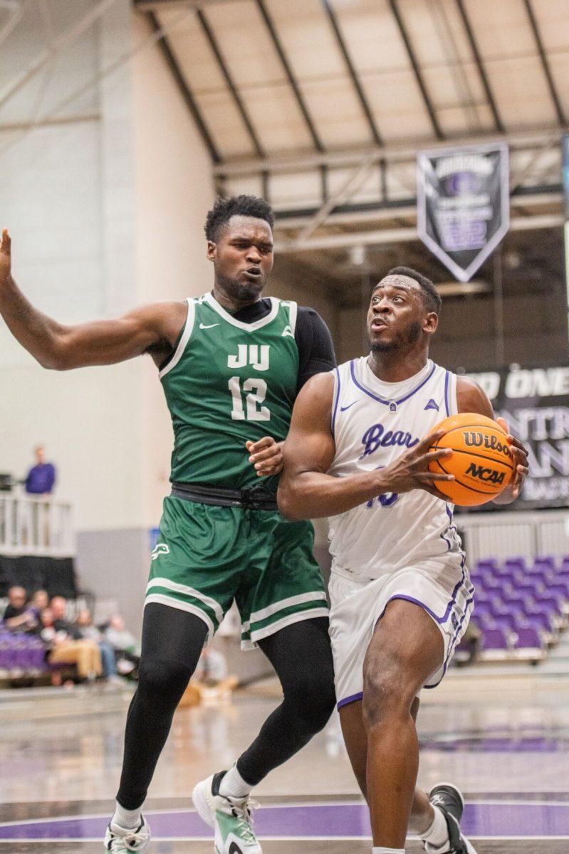 Senior guard/forward Eddy Kayouloud rushes to the net for a layup. Kayouloud earned the most rebounds for the Bears, clocking in at 7 rebounds.