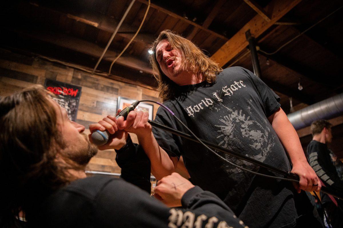 Morbid Visionz vocalist Evan Grove connects with an audience member.