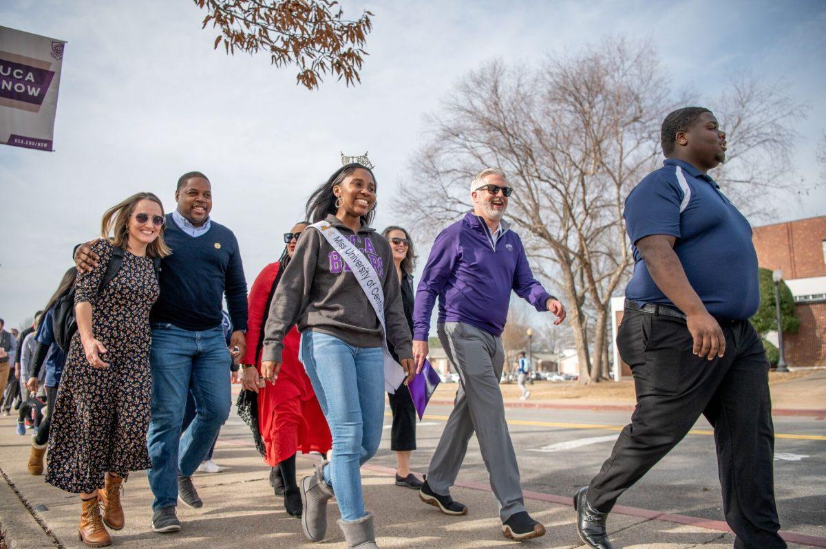 (From left) Jenny Davis, Chris Jones, Miss UCA 2023 Jada Simpson, President Houston Davis and Jeromy Hunt Jr. walk with students and faculty in a silent march around campus Tuesday, Jan. 17 in honor of Martin Luther King Jr. Day. The silent march was hosted by the Students for the Propagation of Black Culture.