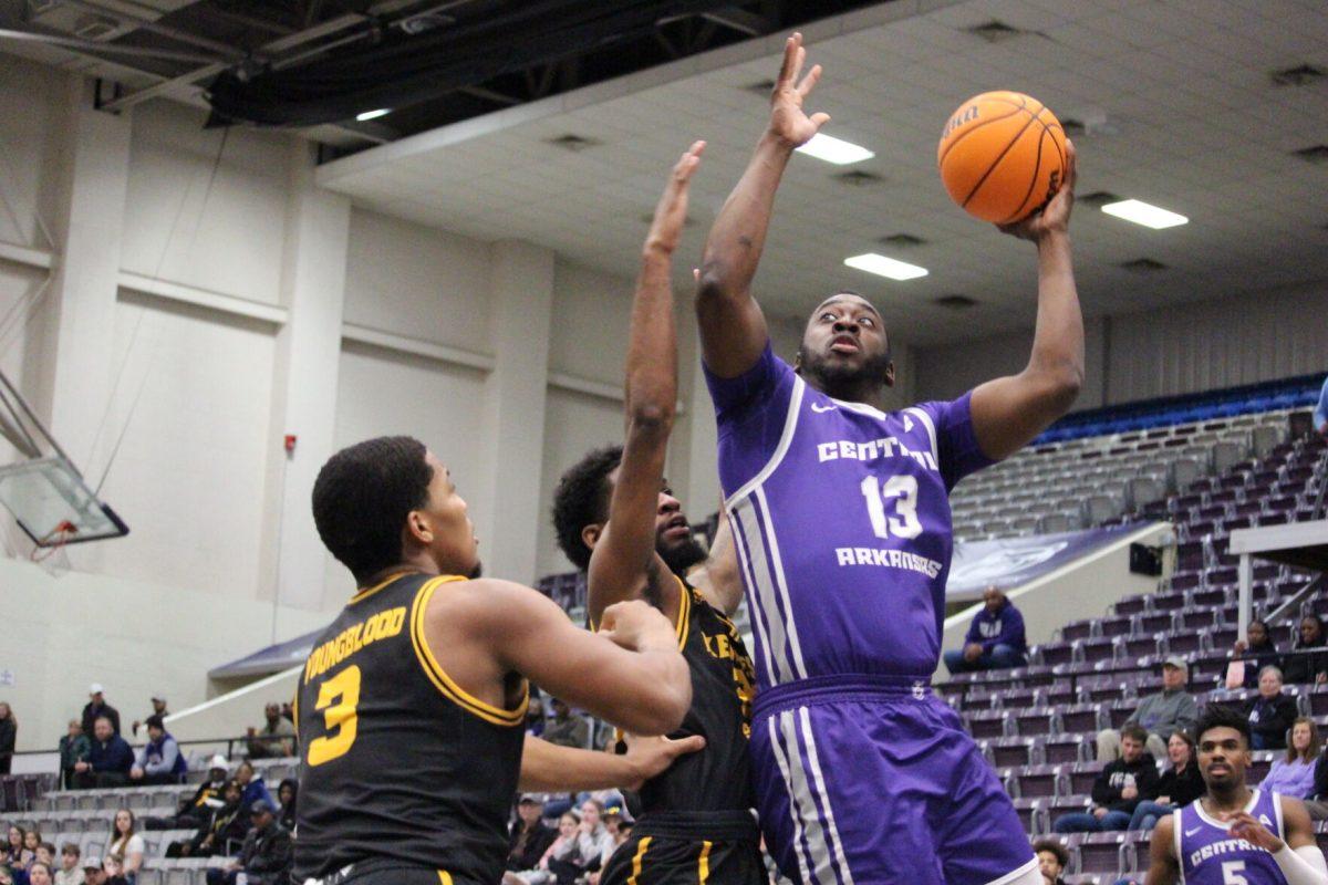 Senior guard/forward Eddy Kayouloud launches himself for a layup against Kennesaw State. Eddy scored a total of 20 points in the game, tying with sophomore guard Camren Hunter.