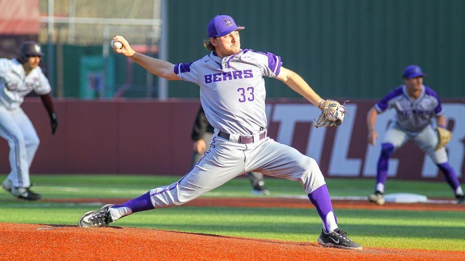 Junior right handed pitcher Oliver Laufman takes a throw at the bottom of the fifth. Laufman earned a total of six strike outs against the Trojans.