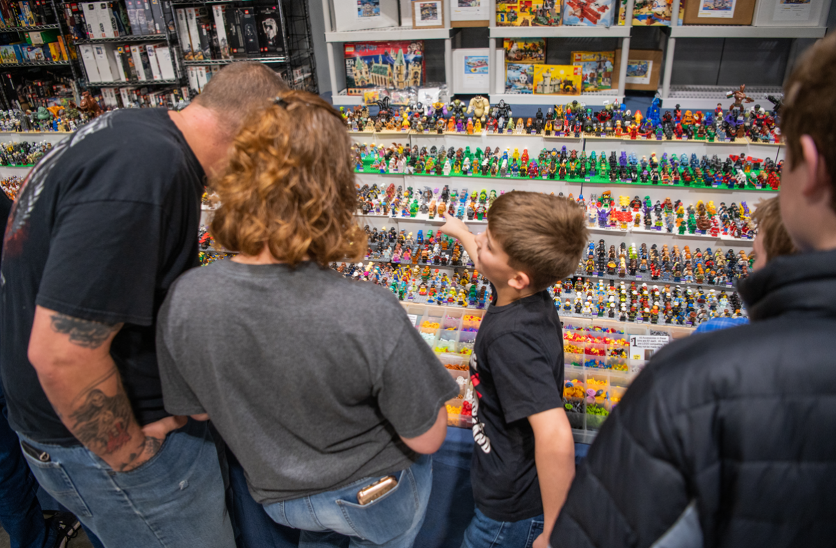 A child points to a Lego minifigure for sale at It's A Block Party. The independent Lego business has been operating for roughly 10 years.
