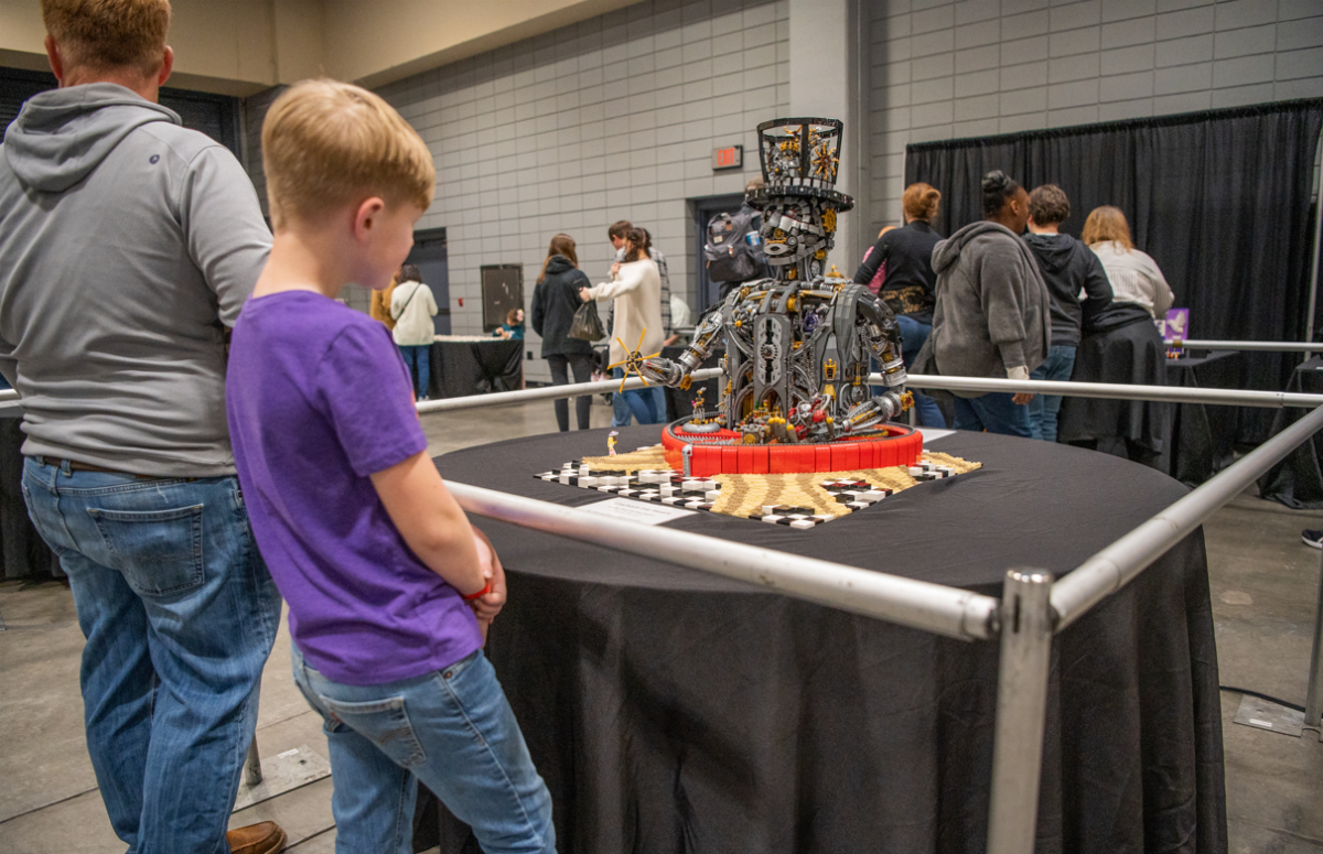 A child looks at Paul Hetherington's "Unchained My Heart." The original creation is steampunk inspired and Hetherington's personal favorite build.