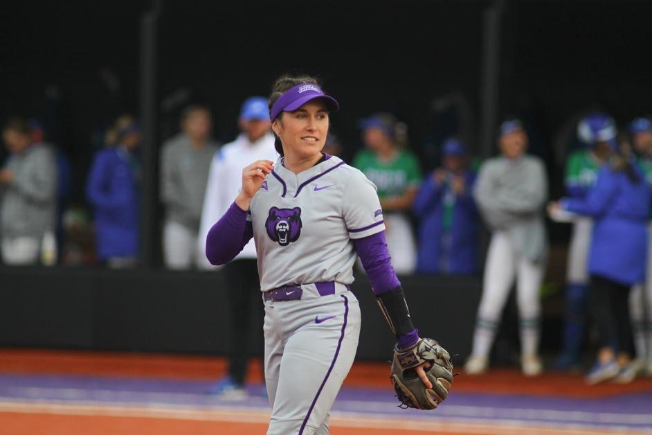 Redshirt junior infielder Madi Young readies herself for the next inning. Young ended the first game with a home run, giving the Bears the win.