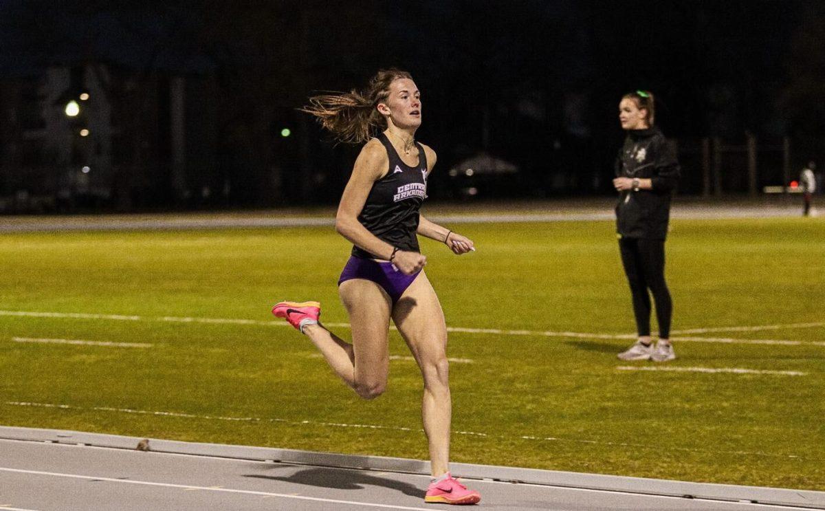 Mid-distance runner Anna Bommes races down the A-State track during the 1500-meter dash. Not only did Bommes come in first place, but also set a new personal record.