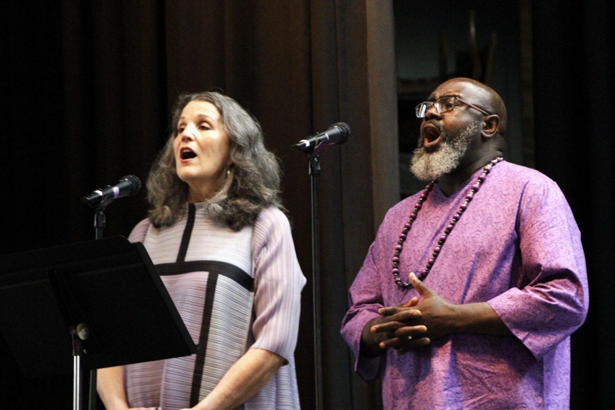 Provost Patricia Poulter and Student Success Coordinator Marvin Williams sing the alma mater at the April 20 memorial event. The annual event will always be on the third Thursday of April to avoid scheduling conflicts, President Houston Davis said.