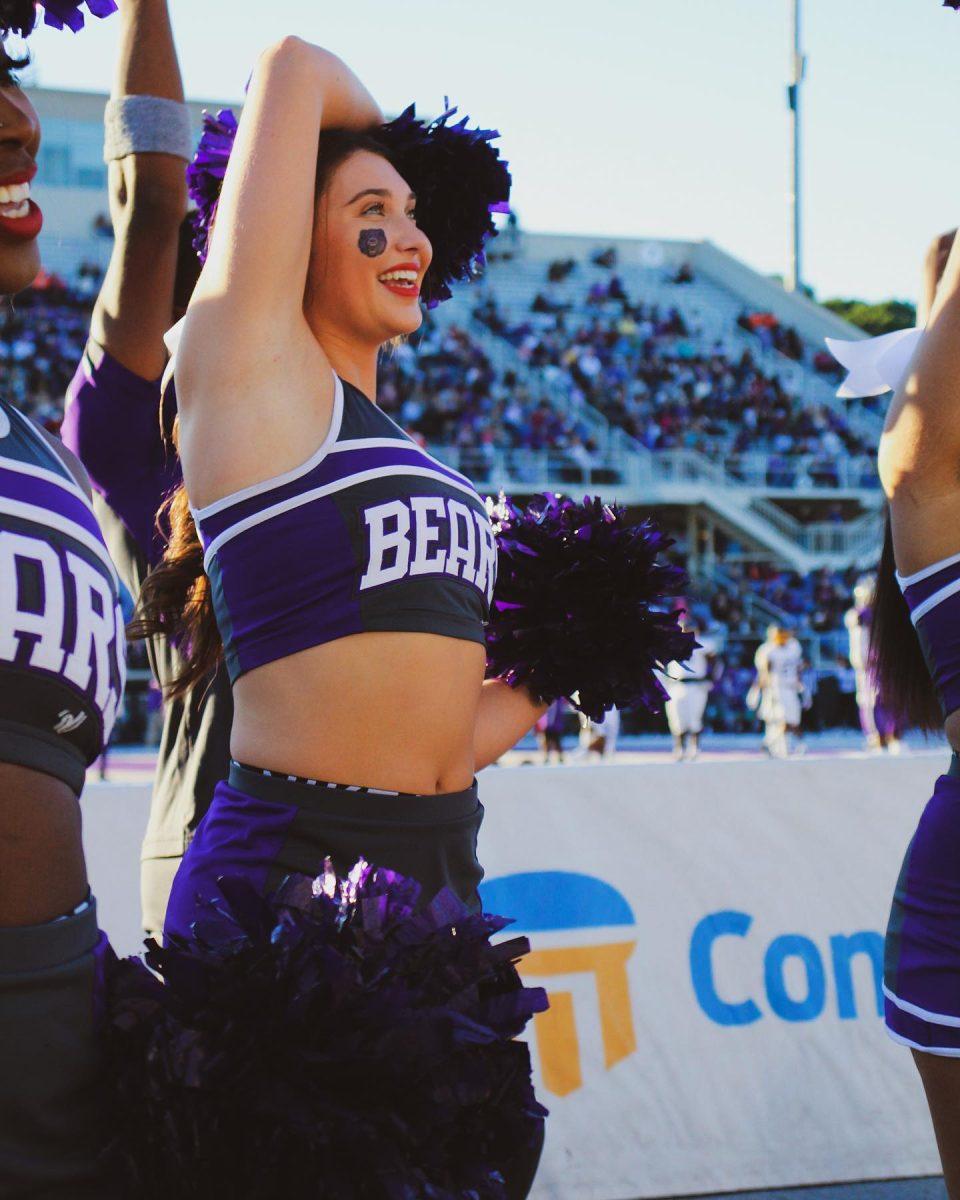 Senior Emma Grace Knight cheers at the final home game of the 2021 season. The cheer team has seen a return after being suspended in February of 2023.
