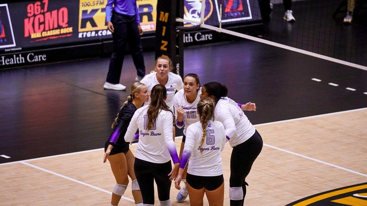 Junior Allison Holloway pulls her team in for a huddle during an intense match. The Sugar Bears fought hard until the end, but ultimately lost the match against the Mizzou Tigers. 