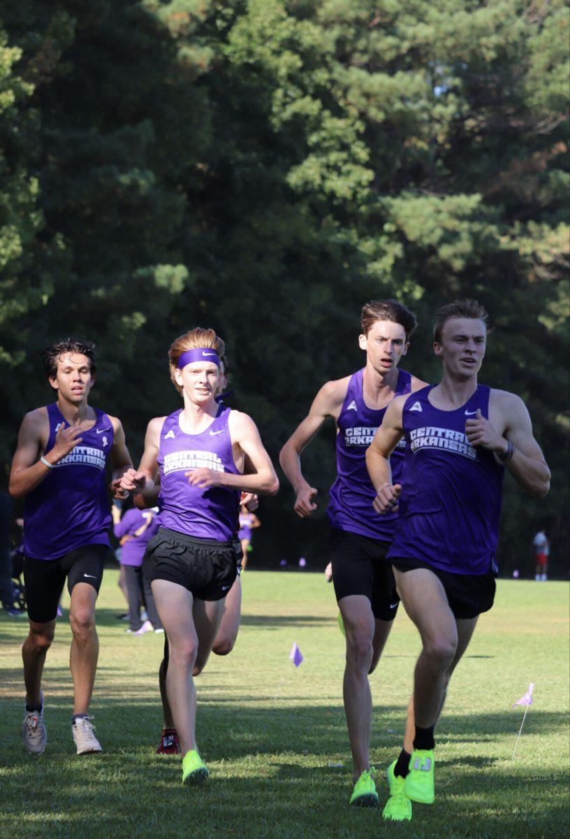 (From left) Senior Thomas Cain, Junior Gavin Frick, Junior Jack Dingman, and Junior Pete Johnson compete in the Governors I-40 Showdown at the Beaverfork Lake Course. Both women’s and men’s cross country teams finished first in
the meet.