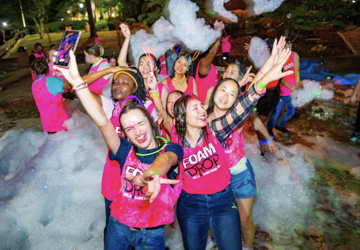 UCA students dance in the Irby brick pit during the Foam Drop Paint Party, organized by the Student Activities Board. The event had foam guns and a DJ.