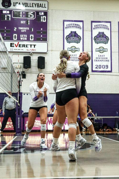 Sugar Bears celebrate scoring a point during the first set, versus UALR
in the I-40 Showdown. The Sugar Bears won 3-1 against the Trojans.