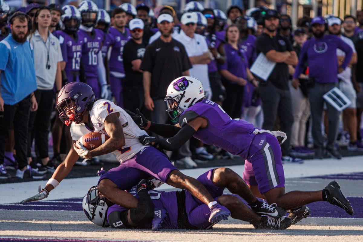 Two UCA defenders work together to bring the offense down. The Bears pummeled the Texas Steers, winning 70-2.