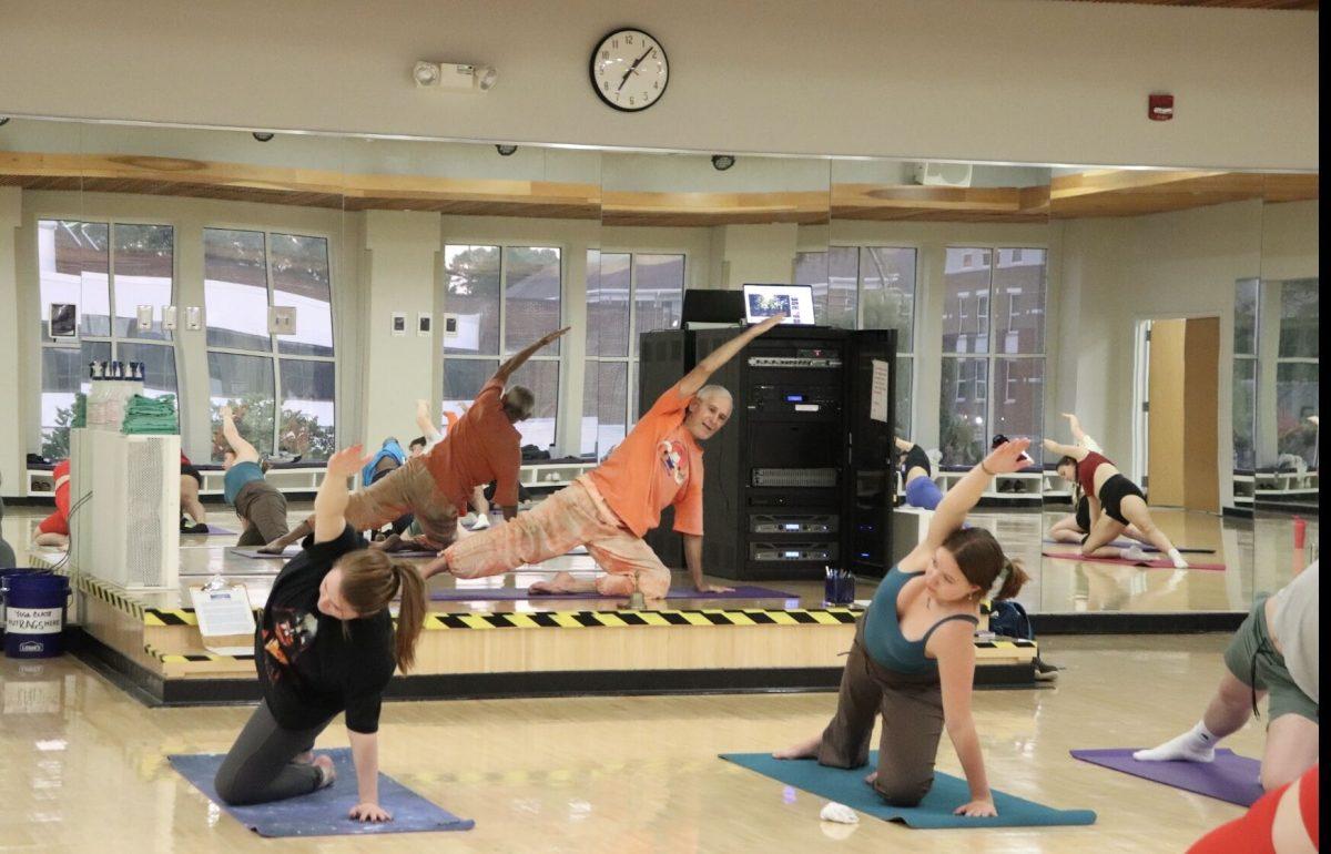 True Alisandre demonstrates stretching exercises and meditation to students. He focused on what the participants wanted to achieve during the class. 