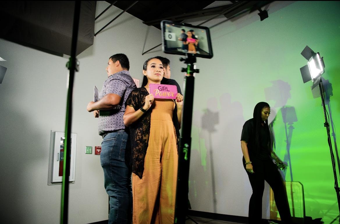 Students use the 360 photo booth at the Latin American Music Festival. The event brought students together to appreciate Hispanic culture during National Hispanic Heritage Month.