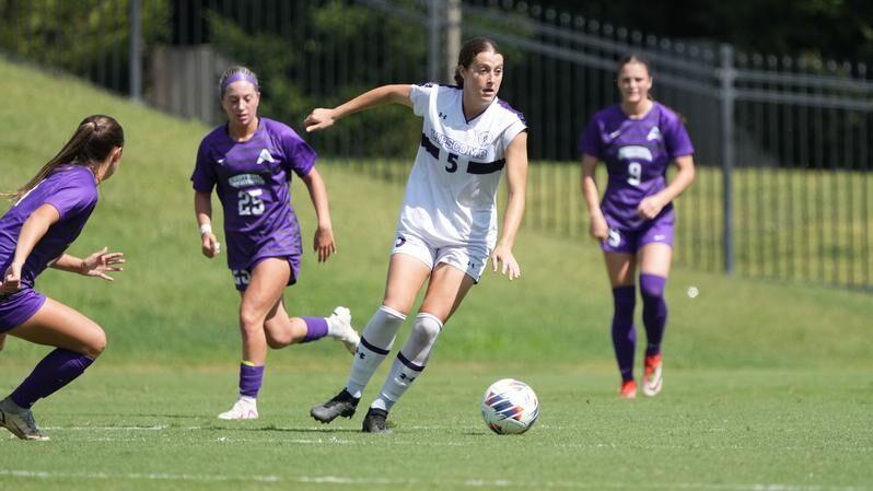 Lipscomb midfeilder and graduate student Kelli Beiler gets surrounded by (left) graduate student midfeilder Sydney Brough and junior forward Anna Kerr. UCA lost the match 1-0, losing its five-game no-loss streak. 
