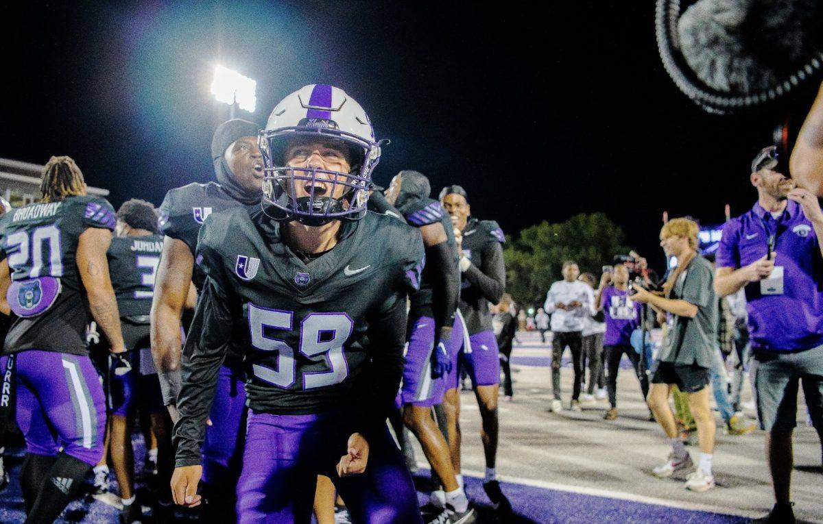 Junior kicker Jake Ward screams in excitement.