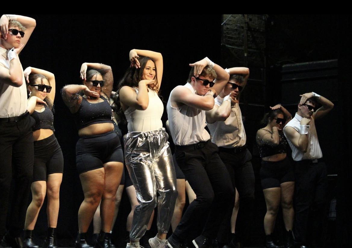 Sunni Harrington (center left), a Junior and Delta Zeta member, wins the title of Greek Goddess at the Sigma Nu pageant. The event also featured a canned food drive.