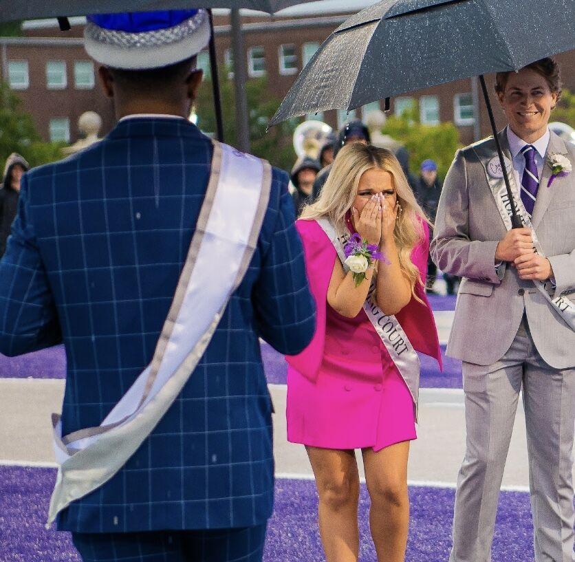 Walker gasps in shock after being named queen.
 