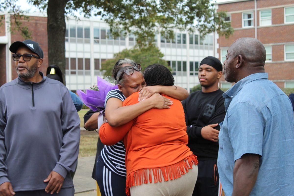 Tamara Henderson, left, and Martha Block, the mothers of the two students who were shot outside of Arkansas Hall 15 years ago, embrace each other during the Henderson-Block Memorial Oct. 26. The two exchanged phone numbers to stay in touch after the service. 