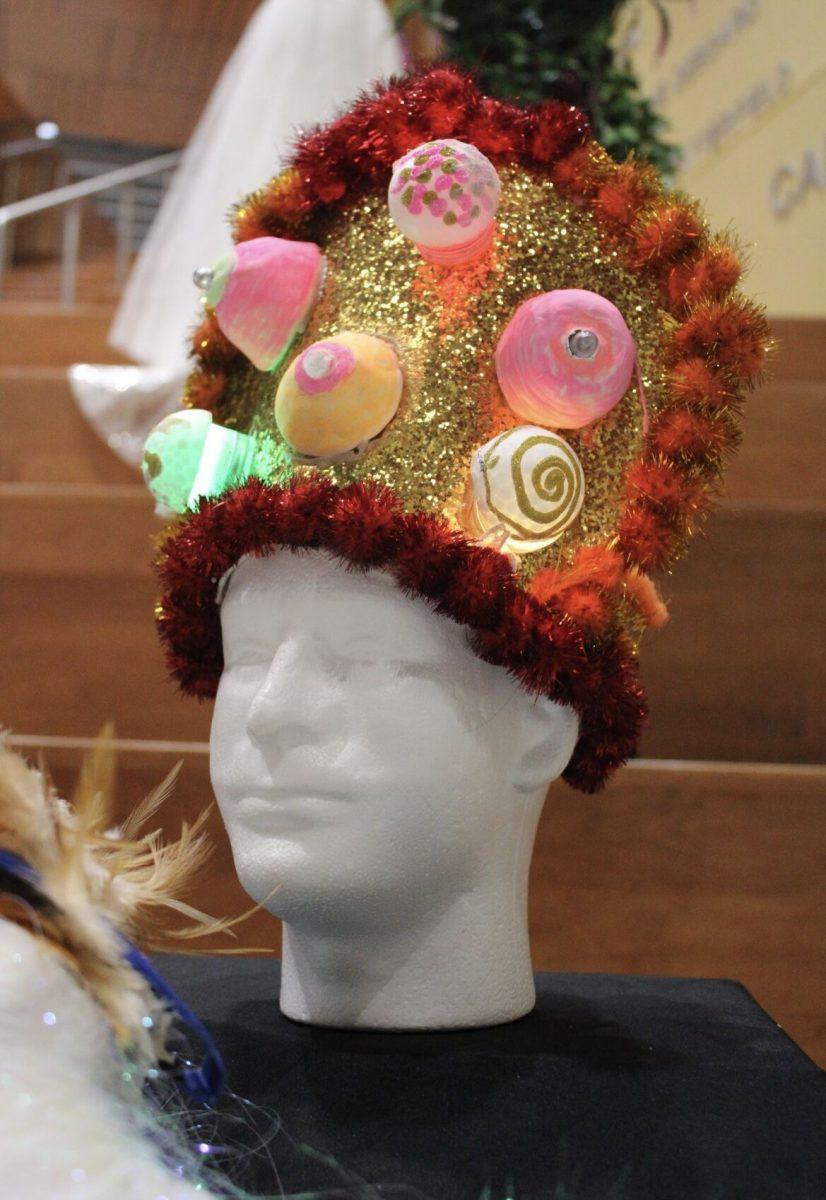Artist Allyson Dombey creates headpieces featuring multiple materials, such as glitter, paint and lights.
