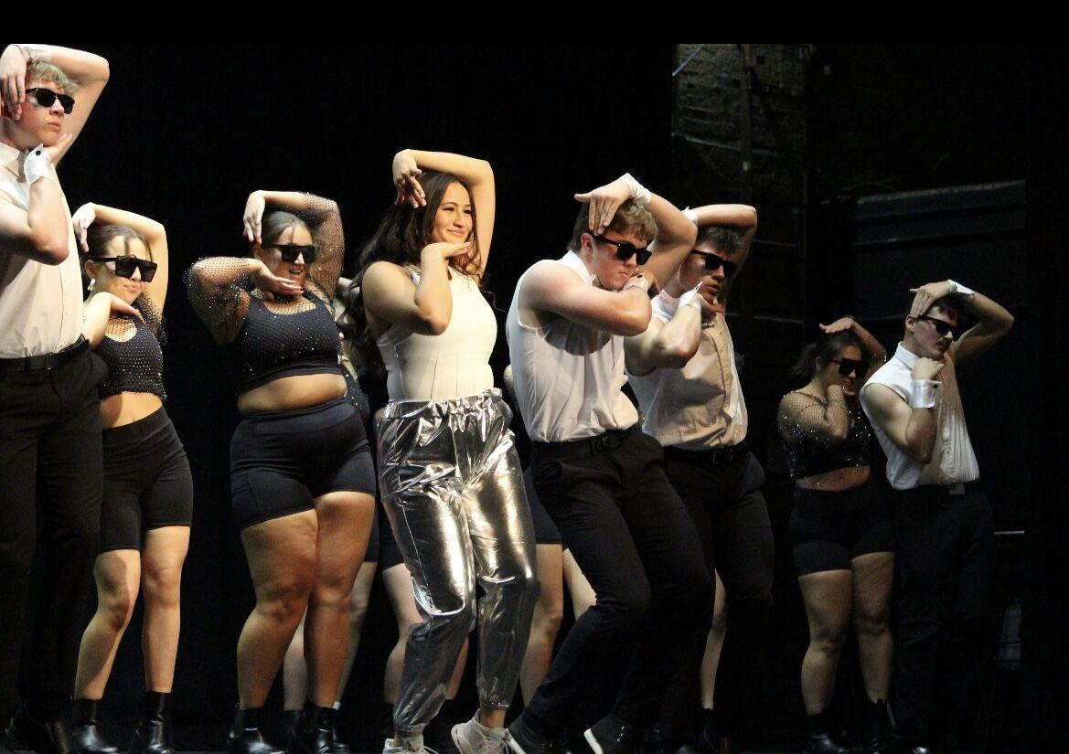 Sunni Harrington (center left), a Junior and Delta Zeta member, wins the title of Greek Goddess at the Sigma Nu pageant. The event also featured a canned food drive.